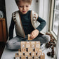 Child playing with ABC and number blocks